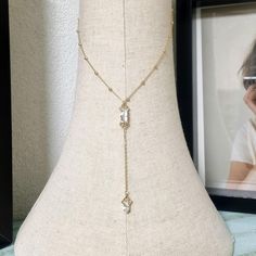 Dainty Lariat baguette CZ centerpiece with a unique metal work, Gold Y necklace for every day wear,  A statement lariat necklace, Features 2 Zirconia crystal pendant combines baguette and marchioness. This stylish necklace features a NICKEL FREE high-quality coated crystal minimalist pendant with a ball necklace. This delicate necklace is perfect for a boho bride or bridesmaid who is looking for a stylish and classic look. You can choose your desired finish - Gold, Rose gold or Silver This neckl Luxury Dainty Lariat Jewelry, Wedding Guest Necklace, Baguette Pendant, Spring Court, Gold Lariat Necklace, Minimalist Pendant, Y Necklace, Stylish Necklace, Ball Necklace