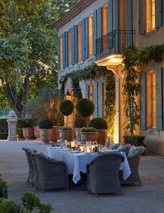 an outdoor dining area with tables and chairs