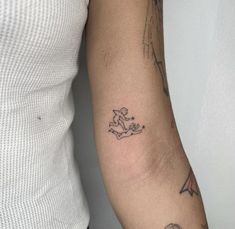 a woman with a tattoo on her arm