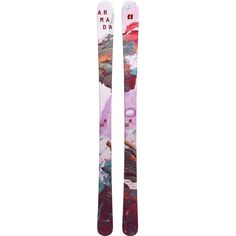 two skis with different designs on them sitting side by side in front of a white background