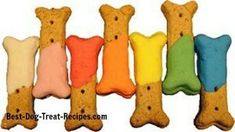 four dog biscuits in the shape of bones with colored frosting on each one side