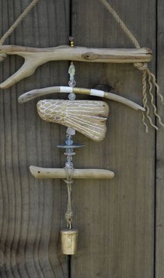 a wind chime hanging from a wooden fence