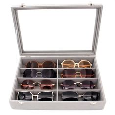 an open case with many pairs of sunglasses in it