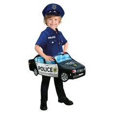 a little boy dressed as a police officer holding a toy car and carrying a suitcase