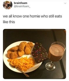 a white plate topped with food next to a glass of milk