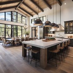 a large kitchen with wooden floors and high ceilings