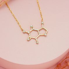 Caffeine Molecule Coffee Lover Gift Necklace, Daimond Chemistry Science Necklace, Science Teacher Barista Gift for Her, Molecule Jewelry Molecule Necklace is something all coffee lovers are sure to like a latte! Always stay caffeinated with this witty and stylish piece of molecule jewelry. If coffee or tea is essential to start your day, this cleverly crafted pendant necklace will be sure to keep you energized! Our caffeine necklace is a perfect gift for all the coffee and tea lovers in your lif Coffee Molecule, Science Necklace, Molecule Design, Molecule Jewelry, Coffee Necklace, Caffeine Molecule, Barista Gift, Molecule Necklace, Chemistry Jewelry