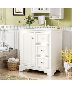 a white bathroom vanity with two drawers and a mirror on the wall next to it