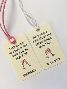 two tags with words on them that say it's hard to drink cocktails