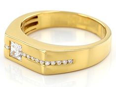 a yellow gold ring with diamonds on the sides and a square shaped diamond in the middle