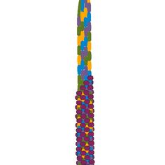 a tall multicolored object is shown in the shape of a column with dots on it