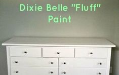 a white dresser with the words dixie belle fluff painted on it's side