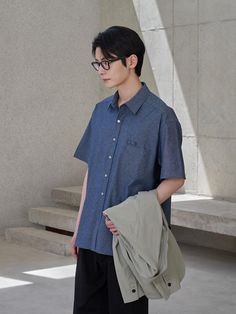 This is lightweight comfortable oversized shirt made from cotton chambray that will create natural washed look by wearing like denim. It's versatile for both casual and classic styling wearing as solo or under the jacket.- Collared neck- Button fastenings - One chest pocket and pencil holder- Short sleeves- Curved hem- Oversized fit Washed Blue Cotton Workwear Shirt, Washed Blue Cotton Shirt For Work, Washed Blue Cotton Shirt For Workwear, Everyday Solid Shirt With Roll-up Sleeves, Everyday Shirt With Roll-up Sleeves, Indigo Cotton Tops With Pockets, Classic Indigo Shirt For Summer, Summer Chambray Denim Shirt, Oversized Washed Blue Shirt For Summer