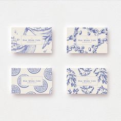 four business cards with blue and white designs on them, all in different shapes and sizes