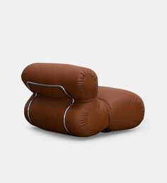 an inflatable chair that looks like it is made out of leather and has two pillows