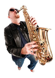 a man in black jacket playing saxophone on white background