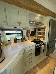 a kitchen area with an oven, stove and refrigerator