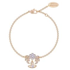 Inspired by antique Victorian diamond jewellery, Vivienne welcomes the ultra-feminine Amma Bracelet. Elegantly designed to simulate a flower, the bracelet is detailed with encrusted hand set white cubic zirconia, beautifully set upon a golden coated brass, completed with the signature hanging Orb. Composition: Brass. Color: gold metallic Charm measurement: 2cm H, 2cm W Bracelet measurement: Length adjustable, 6-7 inch. Come with Vivienne Westwood pouch:) US FAST SHIPPING. Saturn Bracelet, Westwood Jewellery, Vivian Westwood, Empress Dowager, Vivienne Westwood Earrings, Bracelet Rose Gold, Ultra Feminine, Delicate Chain, Diamond Jewellery