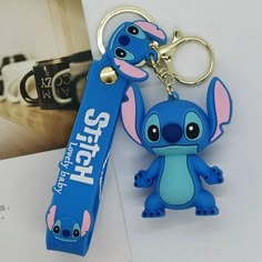 a keychain shaped like stitcher from the movie stitchers is next to a book