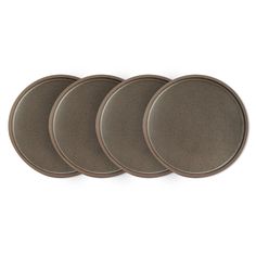 four brown plates sitting on top of each other