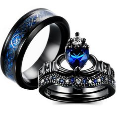 two black rings with blue and white diamonds on them, one has a heart shaped stone in the center