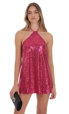 Add this bold hue to your wardrobe to show off , ladies! Dance the day to night away in this flowy bright pink sequin halter dress. Features a sexy open back that shows just the right amount and two dainty double neck ties that add the perfect touch of high-class and romance. Dress it up or down to fit the occasion! Designed In Los Angeles - 100% Polyester- Fully LinedModel is wearing a size small that measures 31in/79cm in lengthSlight modifications might be made to improve garment quality.Hand Pink Mini V-neck Party Dress, Pink Shimmer Sleeveless Mini Dress, Pink Flirty Mini Sequin Dress, Pink Tie-back Backless Halter Dress, Pink Flirty Tie-back Mini Dress, Sequin Halter Dress, Sequin Halter, Loungewear Jumpsuit, Pink Sequin