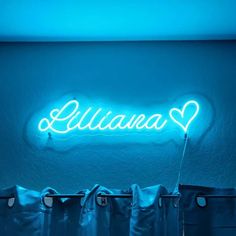 a neon sign that reads,'illumina'in the middle of a room