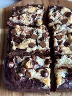 chocolate and marshmallow brownies cut into squares on a wooden cutting board, ready to be eaten