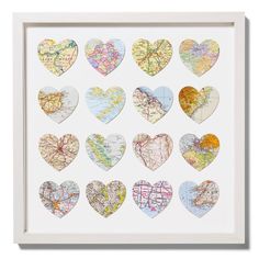 heart shaped maps are arranged in the shape of hearts on a white framed paper frame