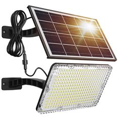 a solar powered flood light with an extension cord attached to the back end of it