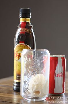 the ingredients to make an ice cream sundae are sitting on a table next to a bottle of coca - cola