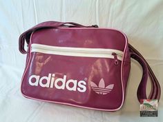 An original vintage Adidas sport bag from the 1980's. An absolute gem for vintage fans. Size:  40 x 30 x15 H x W x D (all dimensions are in cm) Materials: artificial leather, textile, metal condition: The bag is in excellent vintage condition, depending on its age.  The zippers work perfectly. Signs of use. See pictures for details. Shipping: - My shop ships worldwide. - If you like, select the "EXPRESS  shipping" option in the order process to get faster shipping. - You can see the shipping pri Adidas 2000 Vintage, Adidas Bag, Adidas Barricade, Get Faster, Adidas Bags, Vintage Sport, Sports Bags Gym, Adidas Vintage, Vintage Fans