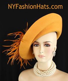 "Women's Designer Haute Couture Antique Gold Mustard Yellow Winter Wool Wide Shaped Brimmed Fashion Hat Trimmed With Expensive Burnt Orange Goose Biot Feathers. Glamorous Clear Acrylic Rhinestones Wrap Around The Outside Wide Brim Of This Stylish Ladies Church Hat. This Formal Winter Wool Dress Hat Is Suited For Winter And Fall Weddings, Church, Formals, Holidays, Horse Races And Special Occasions. This High Fashion Hat Or Headpiece Is Custom Made And Designed By NY Fashion Hats Millinery Headwe Winter Wool Dress, Church Lady Hats, Fascinator Hats Wedding, Formal Hat, Royal Ascot Hats, Couture Hats, Ascot Hats, Church Hat, Tea Party Hats