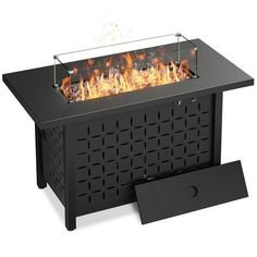 an outdoor fire pit is shown with the lid open and flames coming out from it