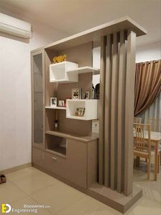 a living room with an open door and shelves