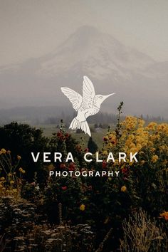 the logo for vera clark photography is shown in front of wildflowers and mountains