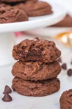 three chocolate cookies stacked on top of each other