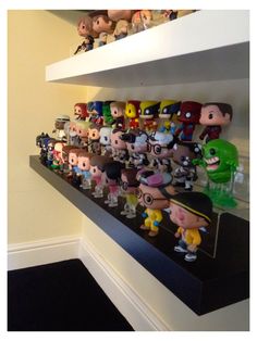 a shelf filled with lots of cartoon figurines on top of eachother