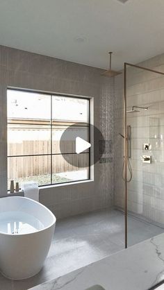 a white bath tub sitting next to a window