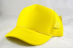 55%foam 45%mest plastic snap closure One size fits all Yellow Trucker Hat Baseball Cap For Spring, Yellow Trucker Hat With Curved Brim For Spring, Yellow Adjustable Trucker Hat For Spring, Adjustable Yellow Trucker Hat For Spring, Yellow Baseball Cap For Spring, Yellow Flat Bill Hat, One Size Fits Most, Yellow Curved Brim Baseball Cap For Summer, Yellow Casual Snapback Hat, Yellow Flat Bill Hat