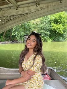 a woman sitting on the back of a boat