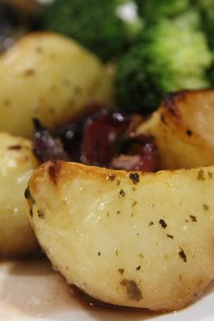 some potatoes and broccoli on a plate