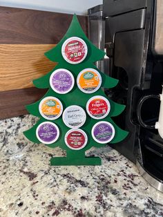 a christmas tree made out of ice creams sitting on top of a marble counter