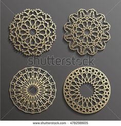 four golden circular ornaments on a gray background