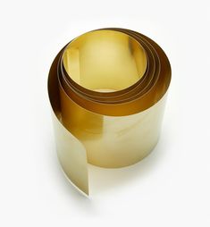 three rolls of gold colored adhesive tape