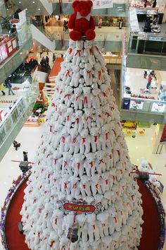 a large christmas tree made out of cans