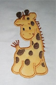 a close up of a giraffe on a white shirt with brown dots and black spots