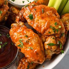 chicken wings with dipping sauce and celery sticks