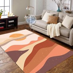 a living room area with a couch, coffee table and large rug on the floor