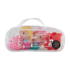 the little mermaids light up bath toys are packaged in a plastic bag with white handles